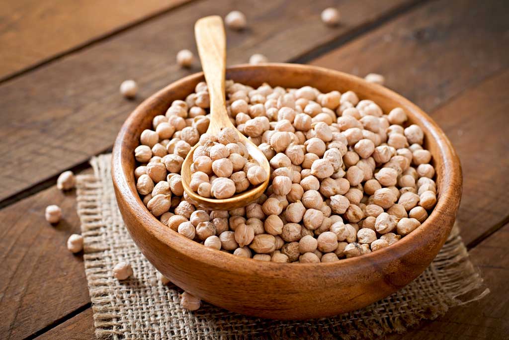 The image shows chickpeas as a high fiber food.