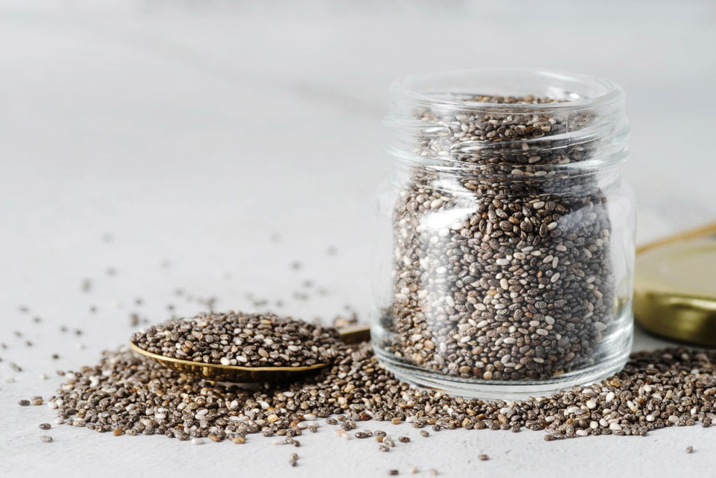 The image shows chia seeds as a high fiber food.